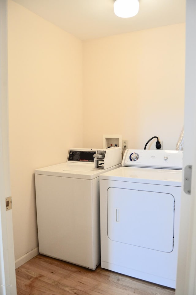 36 Holden St Unit A, North Adams, MA 01247 - laundry area with independent washer and dryer and light wood finished floors