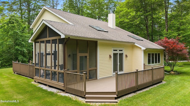 247 Peter Menaker Rd, New Marlborough, MA 01230 - rear view of property with a sunroom, a chimney, roof with shingles, and a wooden deck