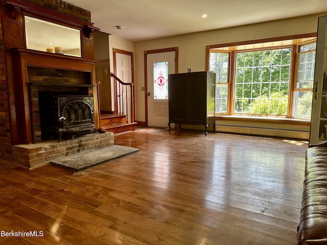 1689 E Windsor Rd, Windsor, MA 01270 - unfurnished living room featuring hardwood / wood-style flooring, recessed lighting, baseboard heating, and stairs