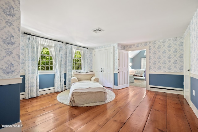 381 Egremont Rd, Sheffield, MA 01257 - bedroom featuring wallpapered walls, wood-type flooring, baseboards, and baseboard heating