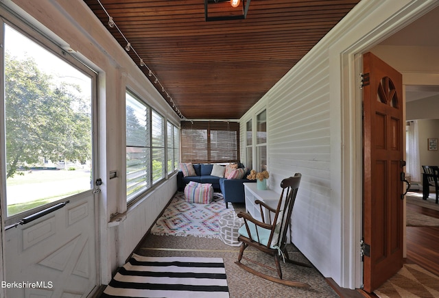 sunroom / solarium with wood ceiling