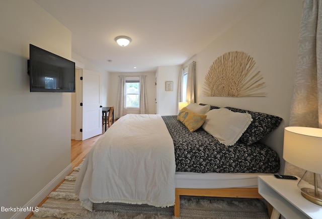 bedroom featuring wood-type flooring