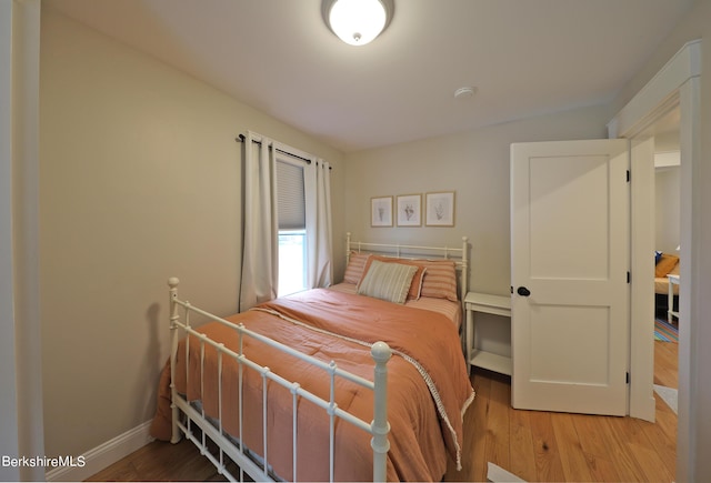 bedroom with hardwood / wood-style floors