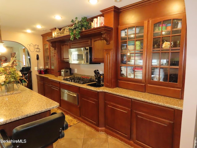 94 Gale Ave, Pittsfield, MA 01201 - kitchen featuring stainless steel microwave, a warming drawer, black gas stovetop, glass insert cabinets, and recessed lighting