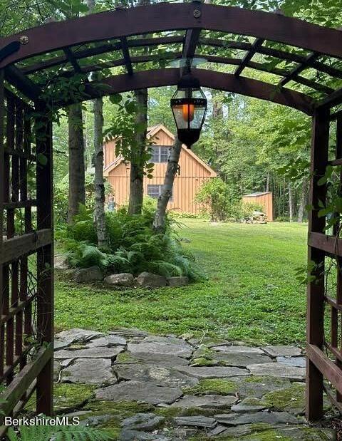 2232 Jacobs Ladder Rd, Becket, MA 01223 - view of grassy yard with a pergola
