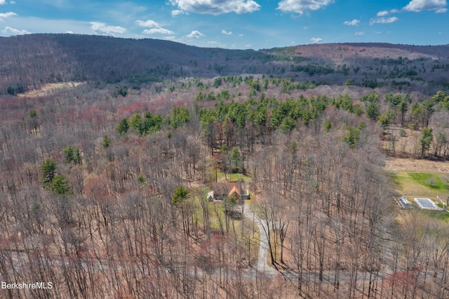 bird's eye view with a mountain view and a forest view