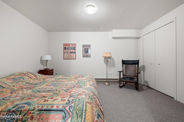 carpeted bedroom featuring a closet and baseboard heating
