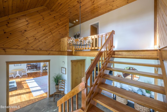 stairs featuring wood ceiling and high vaulted ceiling