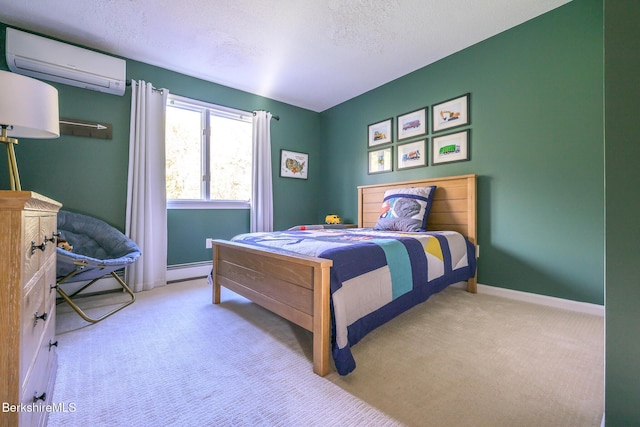 carpeted bedroom with a textured ceiling, a wall unit AC, and a baseboard heating unit