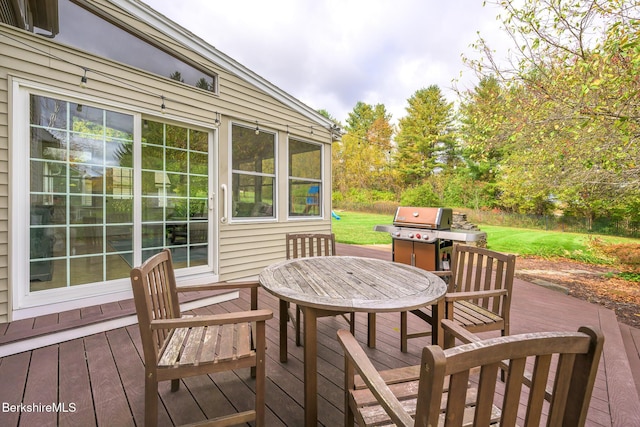 wooden deck featuring grilling area