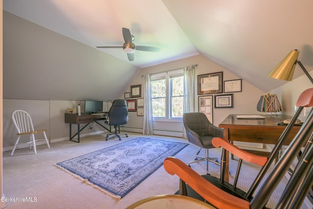 carpeted home office with ceiling fan and vaulted ceiling