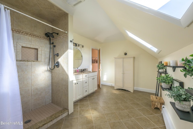 bathroom featuring vanity, lofted ceiling with skylight, and walk in shower