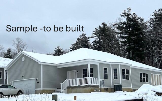 view of front of property featuring central AC unit, a porch, and a garage