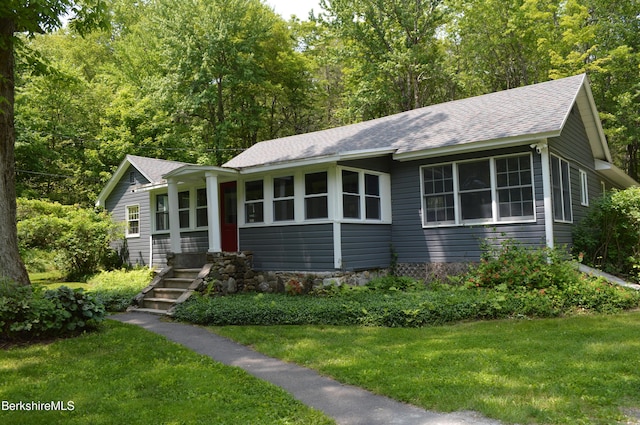 162 Ymca Rd, Becket, MA 01223 - view of front facade featuring a shingled roof and a front yard