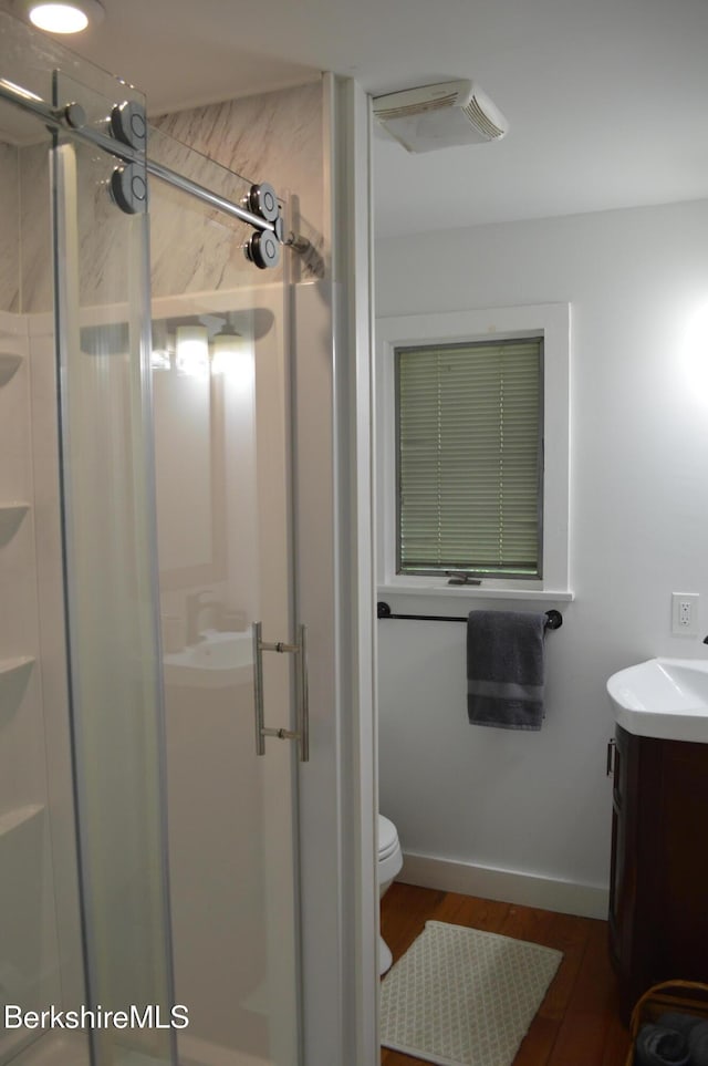 162 Ymca Rd, Becket, MA 01223 - bathroom with vanity, toilet, a stall shower, and wood finished floors