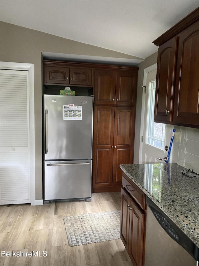 1050 Cape St, Lee, MA 01238 - kitchen featuring stainless steel appliances, light wood-type flooring, and stone counters