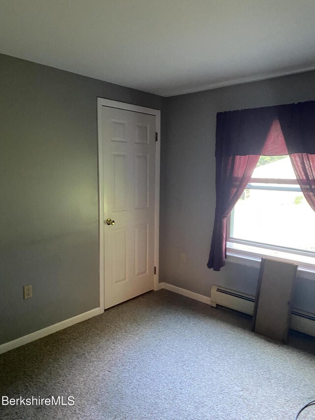 1050 Cape St, Lee, MA 01238 - spare room featuring baseboard heating and carpet floors