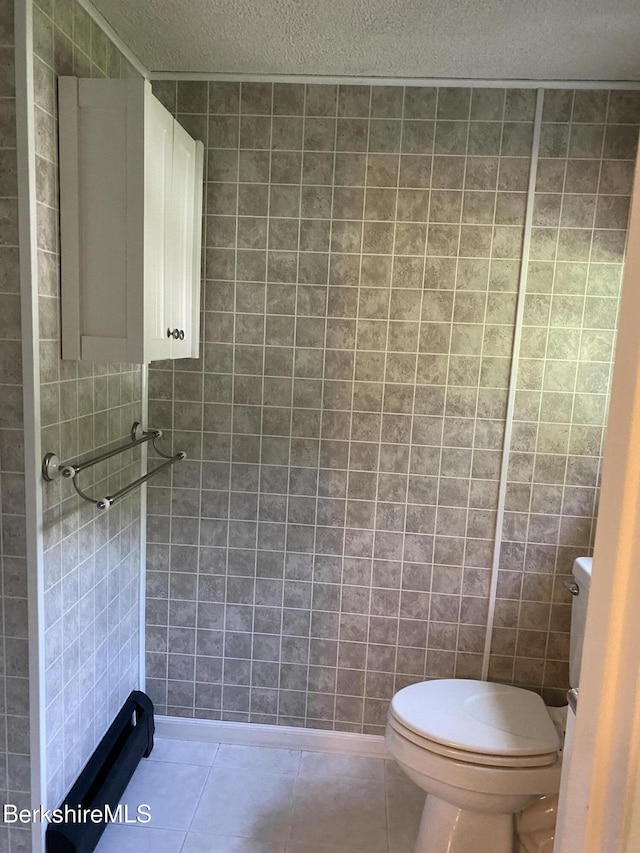 1050 Cape St, Lee, MA 01238 - bathroom with a textured ceiling, tile patterned flooring, and tile walls