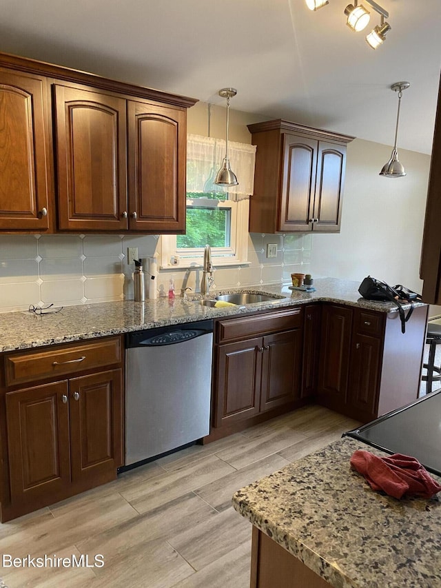 1050 Cape St, Lee, MA 01238 - kitchen with dishwasher, light stone counters, pendant lighting, light wood finished floors, and decorative backsplash