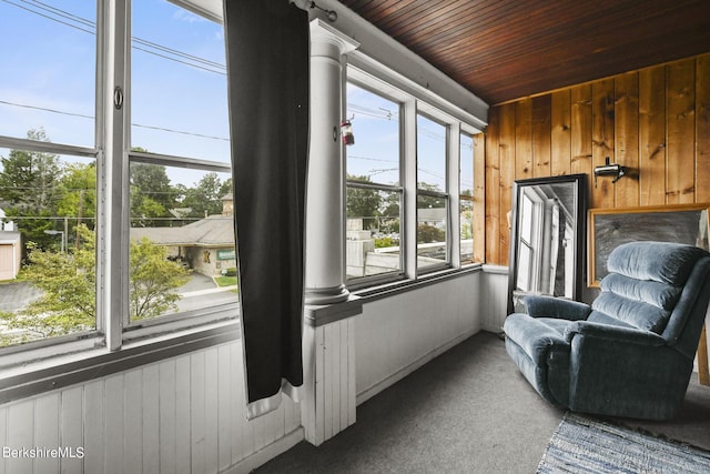 sunroom / solarium featuring wood ceiling