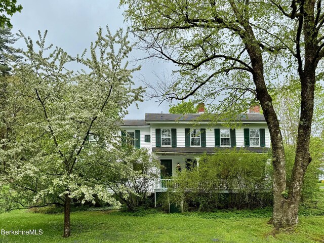 57 S St, Great Barrington, MA 01230 - view of front facade with a chimney and a front lawn