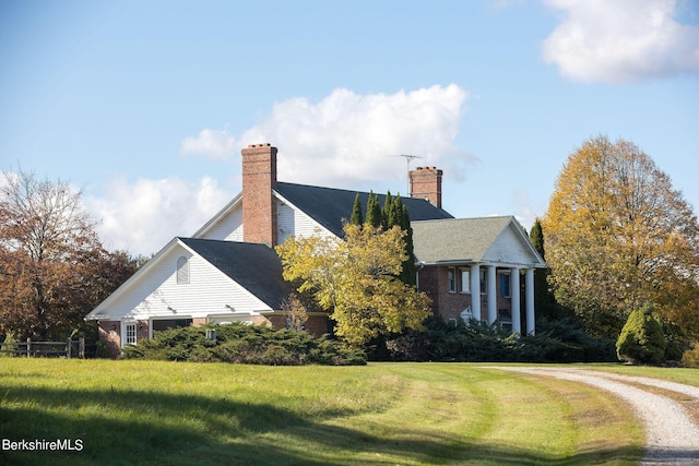 view of property exterior featuring a yard