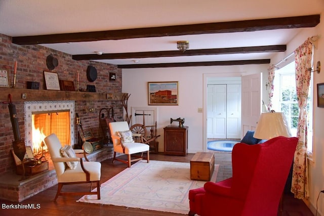 sitting room featuring beam ceiling and hardwood / wood-style flooring