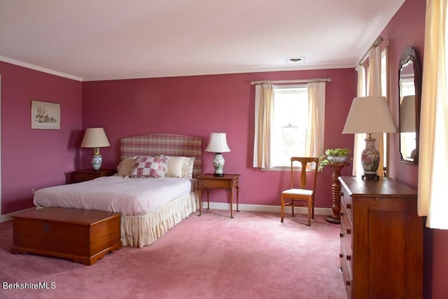 bedroom featuring light colored carpet and crown molding