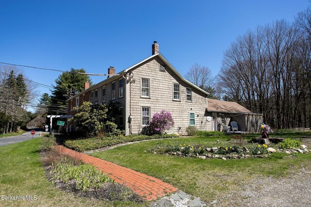 3 Lake Buel Rd, Great Barrington, MA 01230 - view of side of home featuring a lawn and a chimney