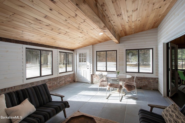 sunroom featuring wood ceiling and vaulted ceiling with beams