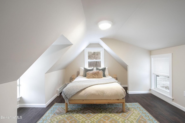 bedroom with baseboards, wood finished floors, lofted ceiling, and a baseboard radiator