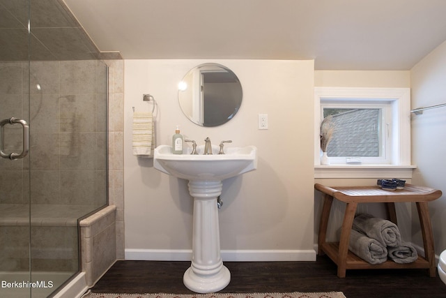 bathroom featuring wood-type flooring and walk in shower