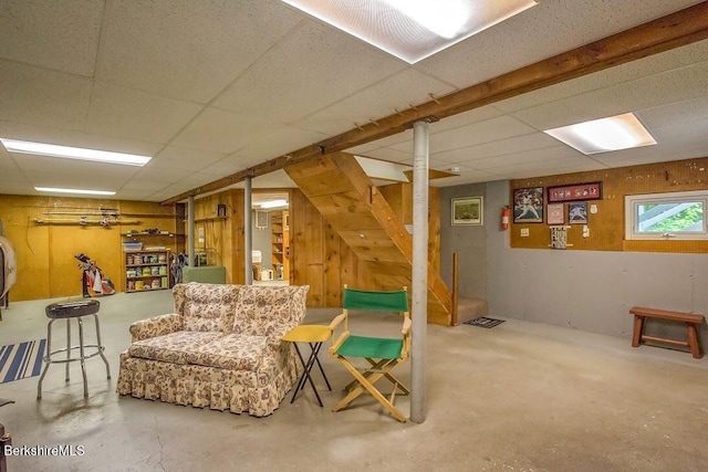 49 Bryant Rd, Otis, MA 01253 - living area with concrete floors, a drop ceiling, and wooden walls
