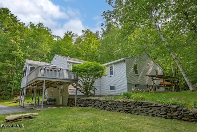 49 Bryant Rd, Otis, MA 01253 - rear view of property featuring a deck, a patio area, and a yard