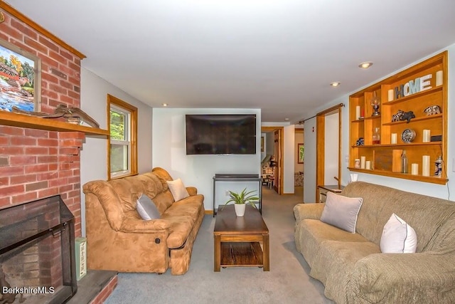 49 Bryant Rd, Otis, MA 01253 - carpeted living room featuring a brick fireplace