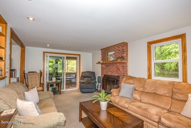 49 Bryant Rd, Otis, MA 01253 - carpeted living room with healthy amount of natural light and a fireplace