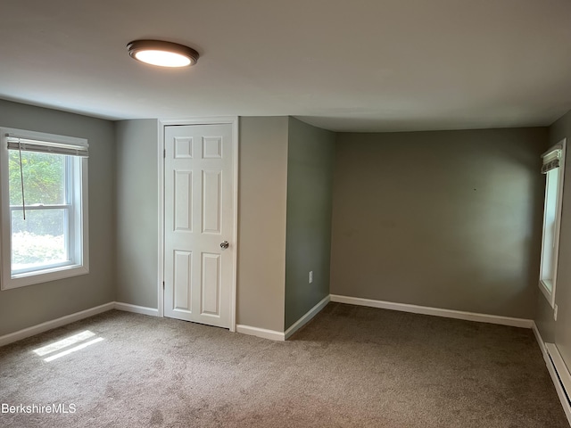 94 John St, Pittsfield, MA 01201 - unfurnished bedroom featuring carpet and a baseboard radiator