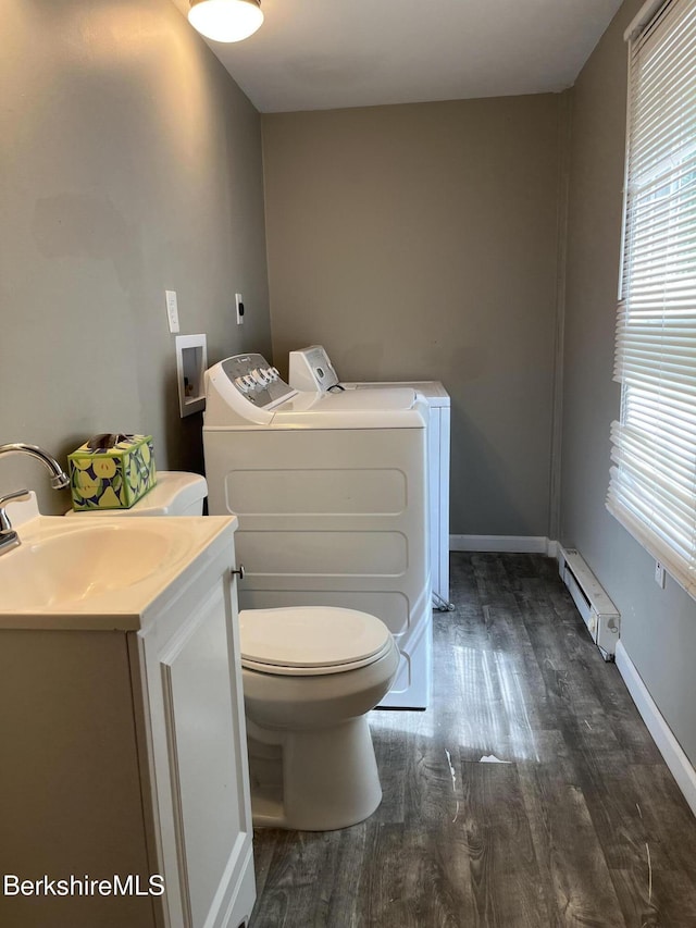94 John St, Pittsfield, MA 01201 - bathroom with independent washer and dryer, a baseboard heating unit, wood finished floors, and vanity