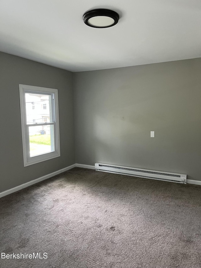 94 John St, Pittsfield, MA 01201 - carpeted spare room featuring a baseboard heating unit and baseboards