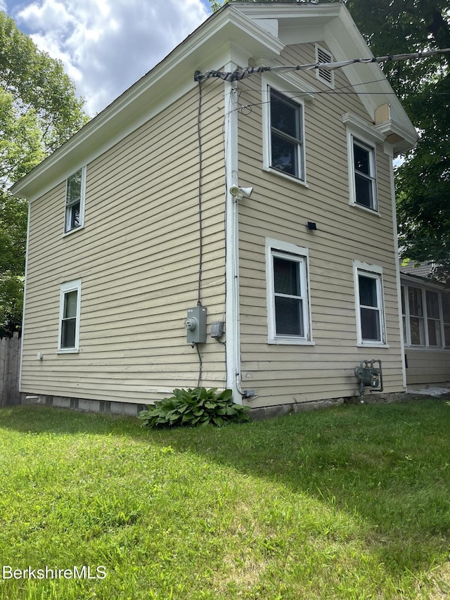 94 John St, Pittsfield, MA 01201 - view of home's exterior with a lawn