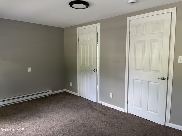 94 John St, Pittsfield, MA 01201 - unfurnished bedroom with dark carpet and baseboard heating