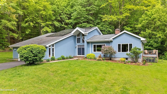505 Kirchner Rd, Dalton, MA 01226 - mid-century home featuring a chimney, a deck, a front lawn, and a wooded view