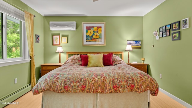 505 Kirchner Rd, Dalton, MA 01226 - bedroom featuring a wall mounted air conditioner, baseboard heating, wood finished floors, and multiple windows