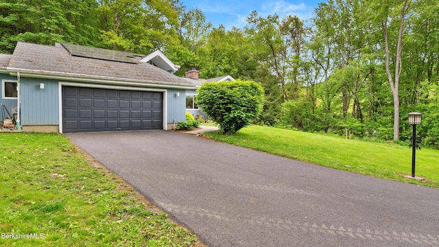 505 Kirchner Rd, Dalton, MA 01226 - garage featuring driveway and roof mounted solar panels