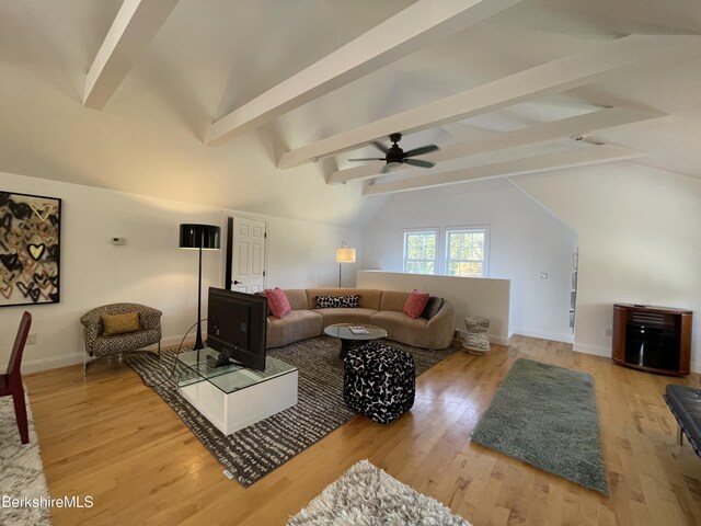 living room with ceiling fan, lofted ceiling with beams, and wood-type flooring