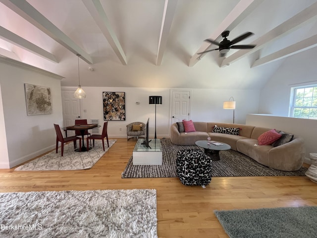 living room with hardwood / wood-style floors, lofted ceiling with beams, and ceiling fan