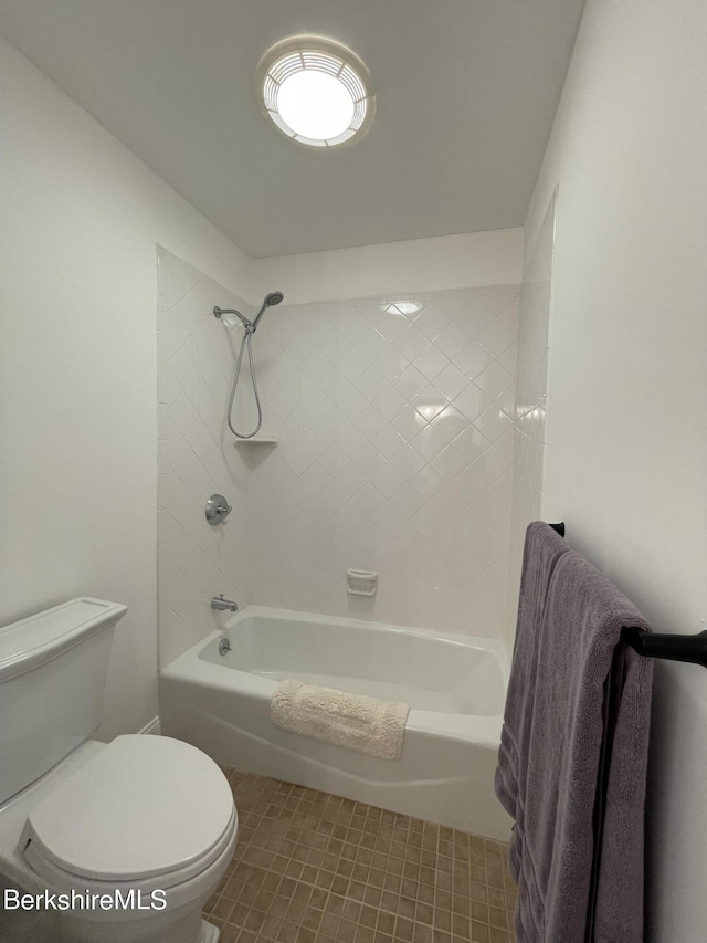 bathroom featuring shower / washtub combination and toilet