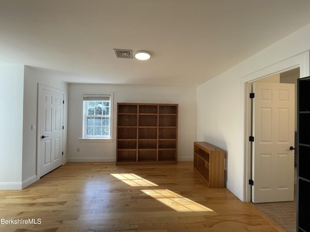 empty room with light wood-type flooring