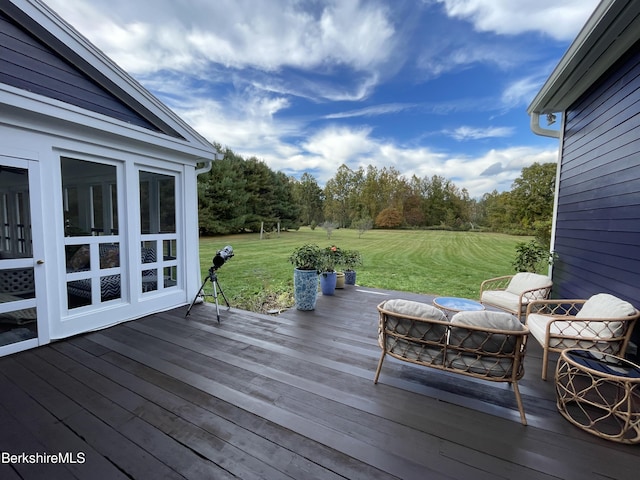 wooden terrace with a yard