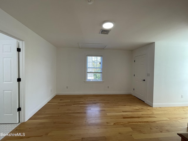 spare room featuring light wood-type flooring